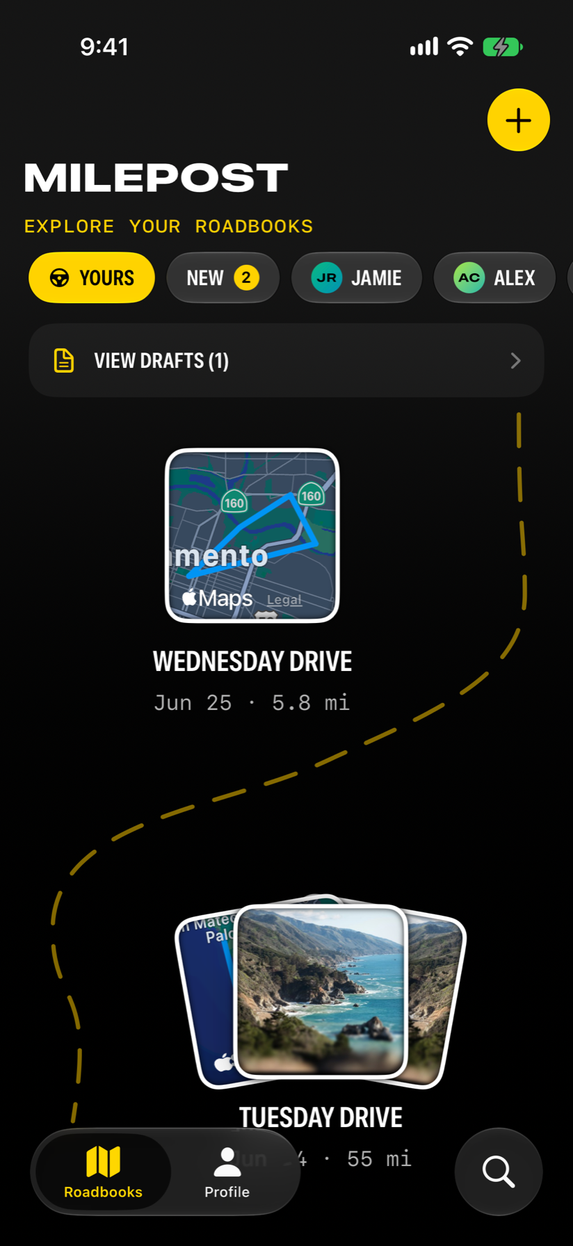 Milepost Roadbooks screen showing saved drives arranged along a winding road.
